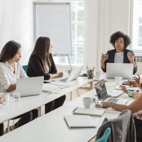 A small group of business people in a training meeting.