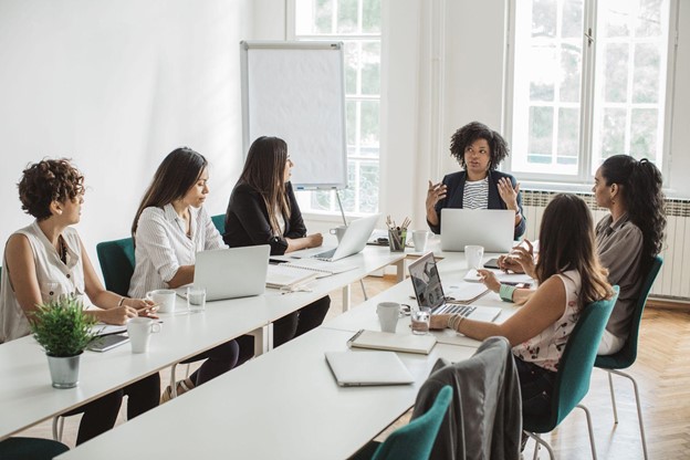 A small group of business people in a training meeting.