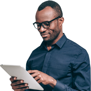 A smiling man interacting with his tablet..