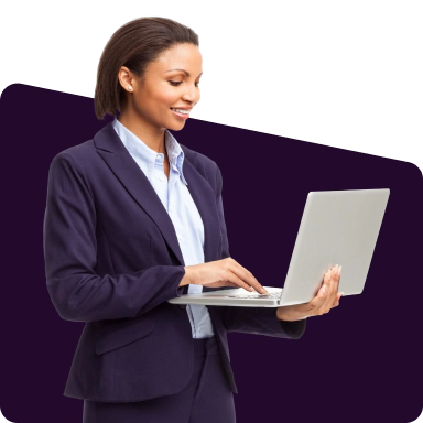 Standing woman engaged with an open laptop.