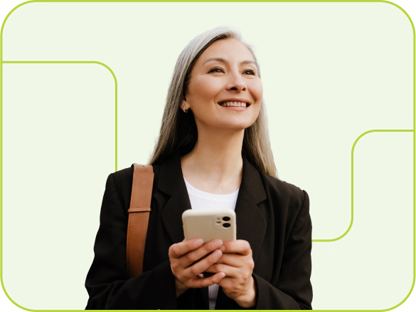 A smiling woman holding a mobile phone.