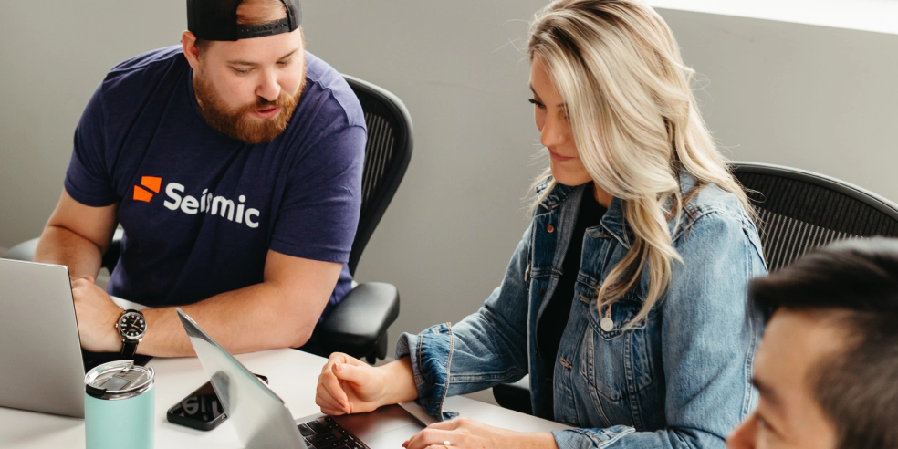 A group of people working together in an office setting.