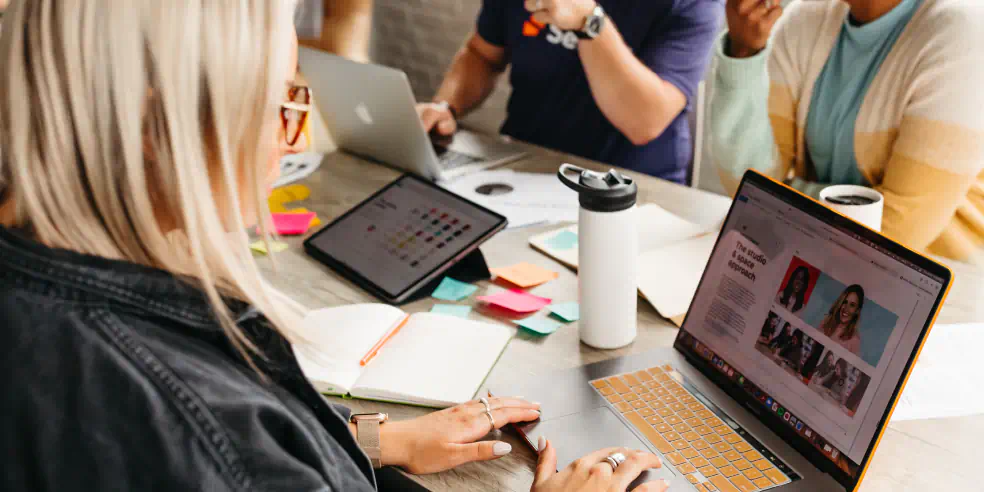 A small group of sales people in a meeting.